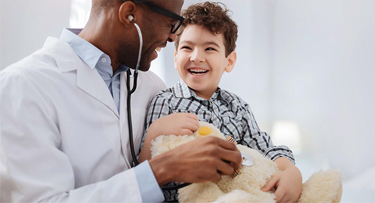 Doctor smiling at a young child